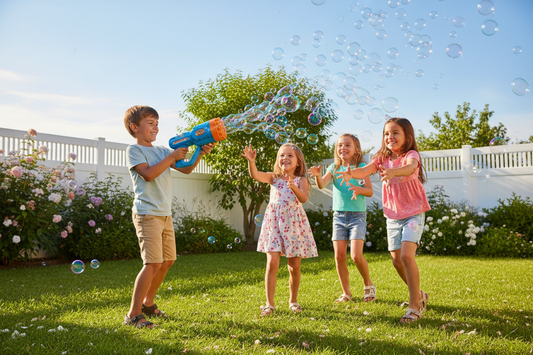 Kids playing with outdoor bubble blaster toy